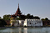 Myanmar - Mandalay, The Royal Palace, the walled enclosure with huge tiered roof tower. 